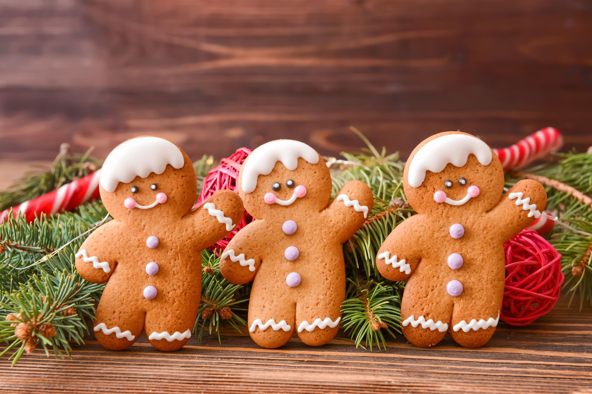 Christmas composition with gingerbread cookies on wooden background